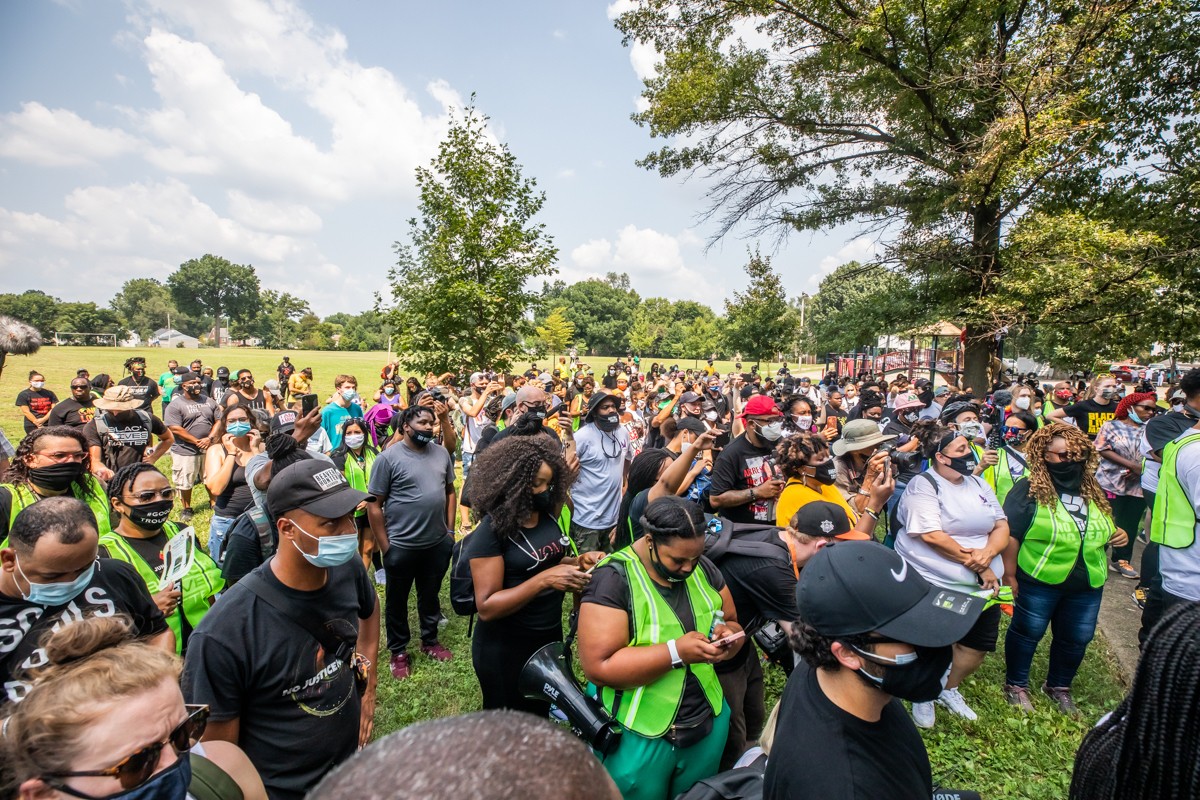 Protesters gathered in South Central Park on Tuesday before marching to the LMPD Training Academy. - KATHRYN HARRINGTON