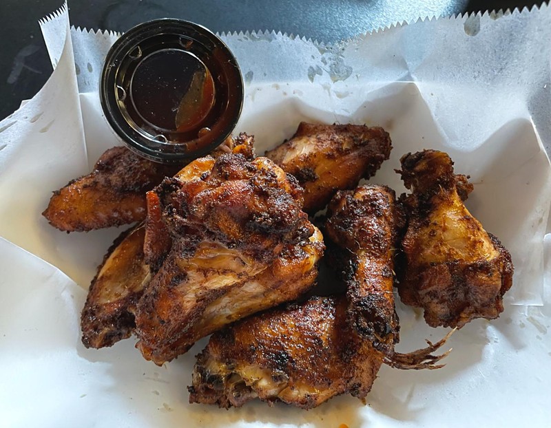 Four Pegs is famous for its wings, and they come in a range of flavors. These basic dry-rubbed, hickory-smoked wings alone, tender, juicy, and deliciously smoky, deserve a trophy.