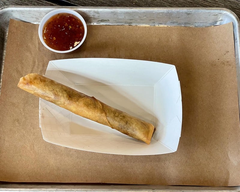 A single lumpia from Sarap Filipino Eatery, a crunchy long pastry roll filled with beef and veggies. - Robin Garr