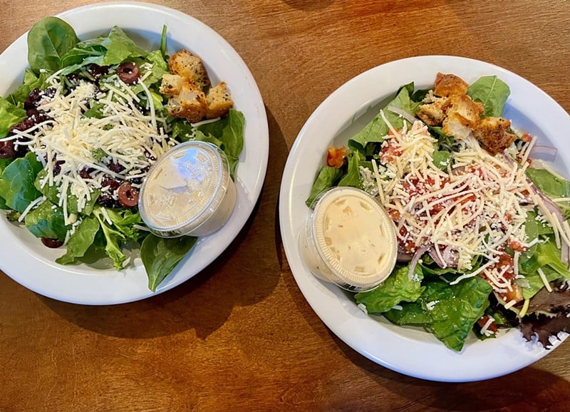 Side salads rarely earn high accolades, but the Caesar (left) and house salads at The Post are exceptional, from the fresh spinach leaves to crisp, airy croutons. - Garr