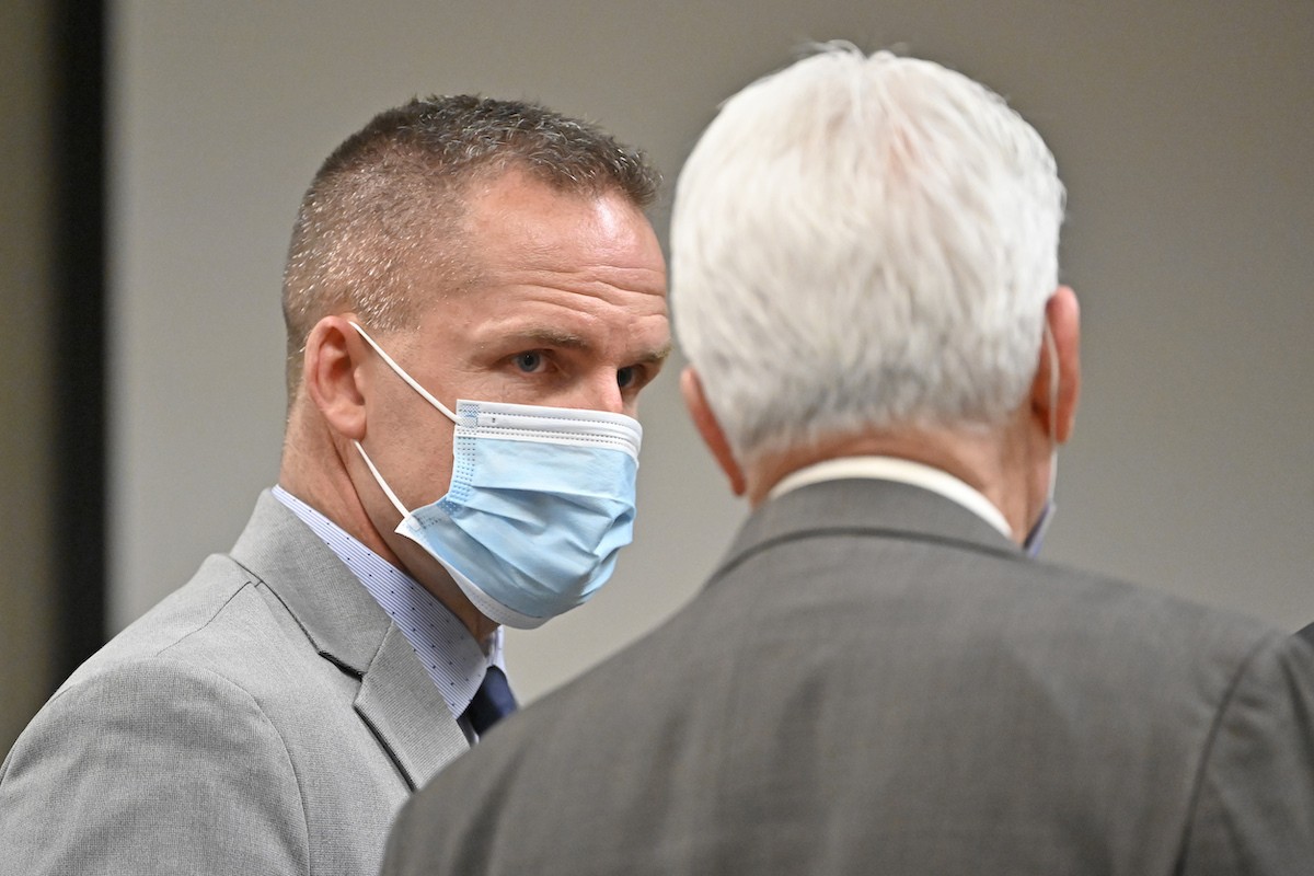 Former Louisville Police officer Brett Hankison, left, speaks with his attorney Stewart Mathews before the resumption of his trial Tuesday, March 1.
