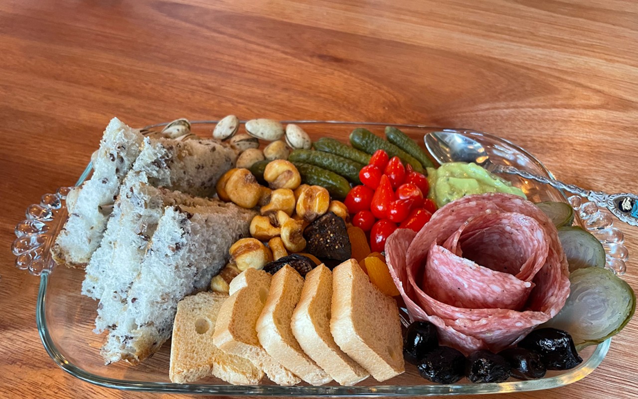 What's a charcuterie plate? This item from Harvey's tells the story: It's an artful display of meat and cheese, a rose-like round of thin-sliced fennel-scented finnochiona salami and a happy contingent of accompaniments.