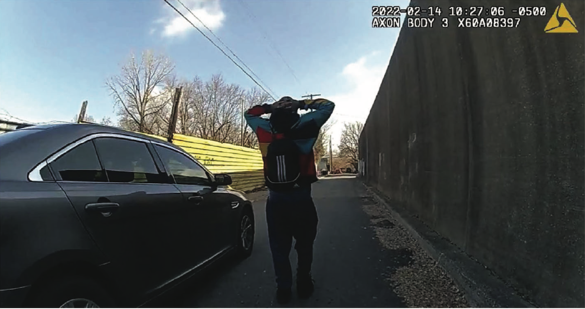 A still image from police body camera footage shows Quintez Brown with his heads behind his head on Quincy Street in Butchertown following the Feb. 14 shooting at mayoral candidate Craig Greenberg's campaign office.